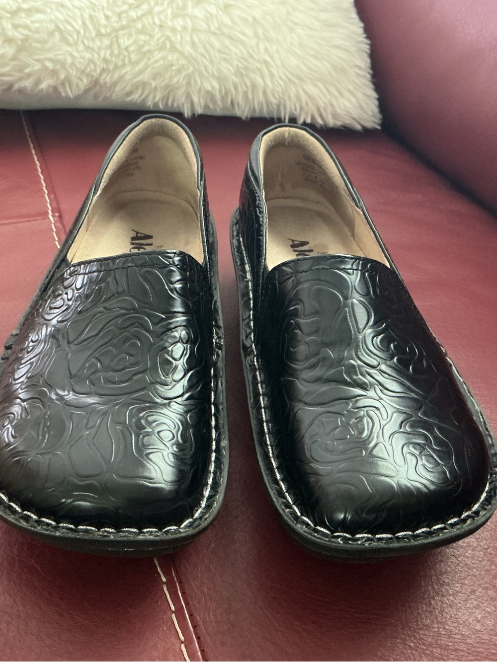 Embossed Floral Clog Loafers in Black by Alegria.